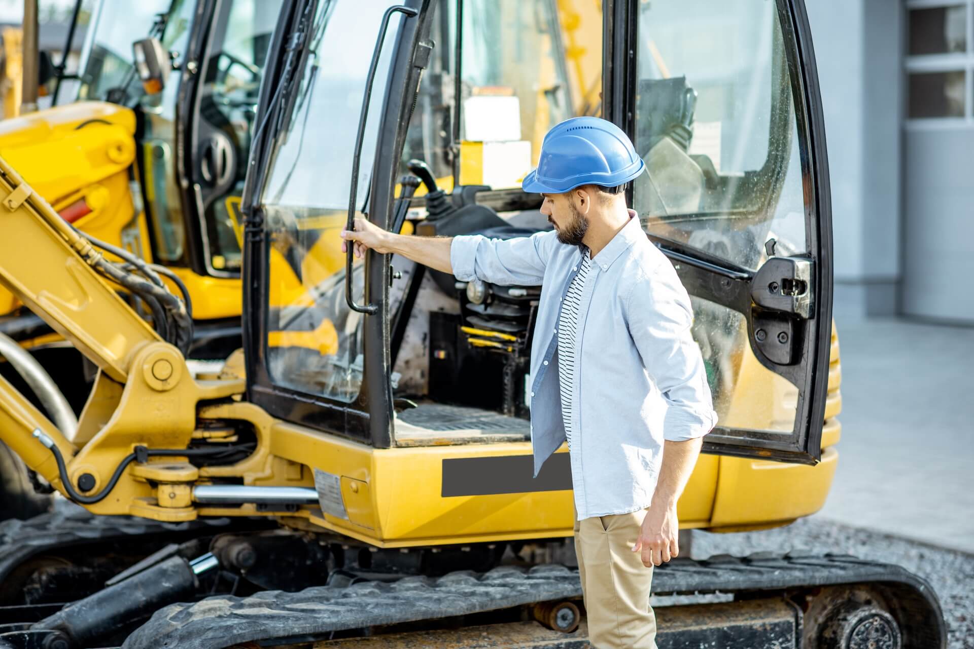 Contractor in the process of buying construction equipment | Featured image for Buying Construction Equipment - Tips & Considerations blog by Machinery Direct.