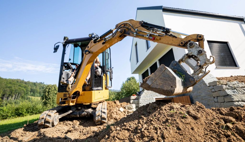Mini excavator being used on site | Featured image for Must Have Hire Machines for Your Motor Pool on Machinery Direct.